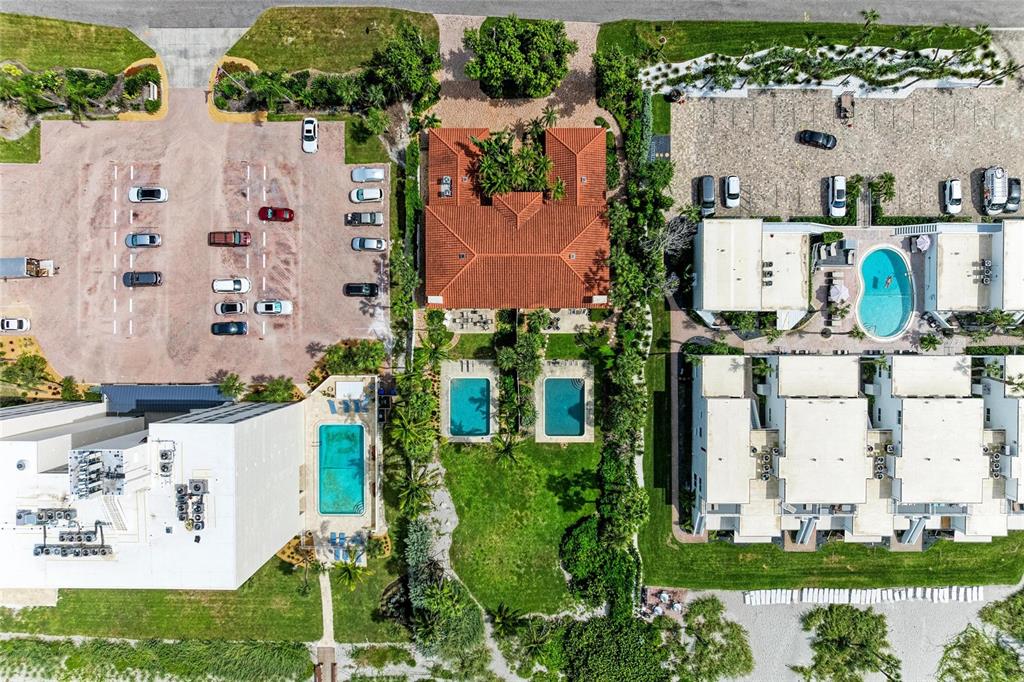 4473 Gulf Of Mexico Drive, Unit 4473 Longboat Key, FL 34228 - Photo 27 of 50 an aerial view of residential houses with outdoor space and parking