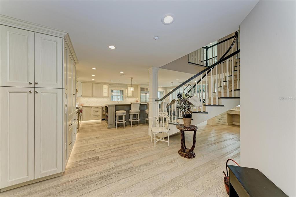 4473 Gulf Of Mexico Drive, Unit 4473 Longboat Key, FL 34228 - Photo 3 of 50 a view of entryway and hall with wooden floor