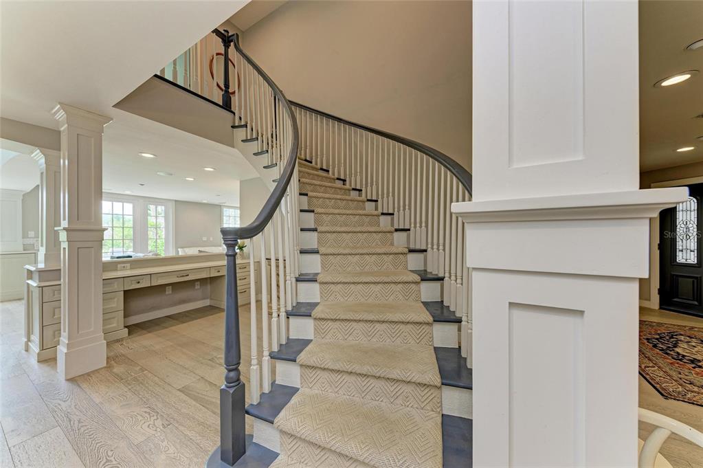 4473 Gulf Of Mexico Drive, Unit 4473 Longboat Key, FL 34228 - Photo 10 of 50 a view of entryway and hall with wooden floor