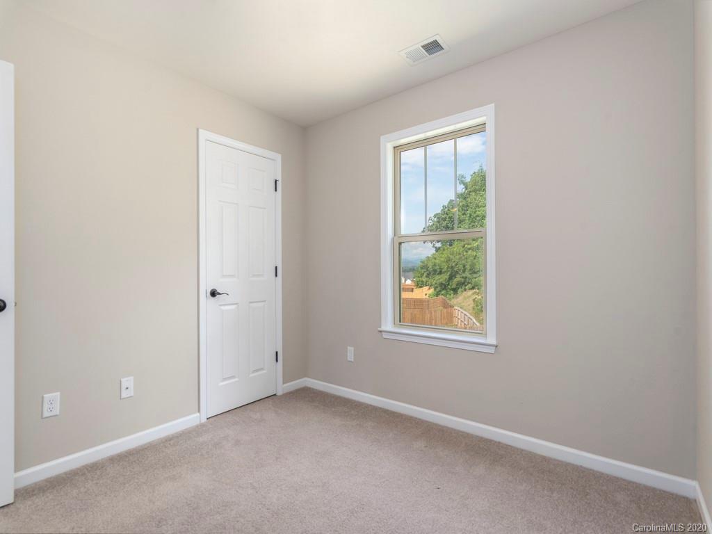189 North River Road Fletcher, NC 28732 - Photo 19 of 27 an empty room with a window