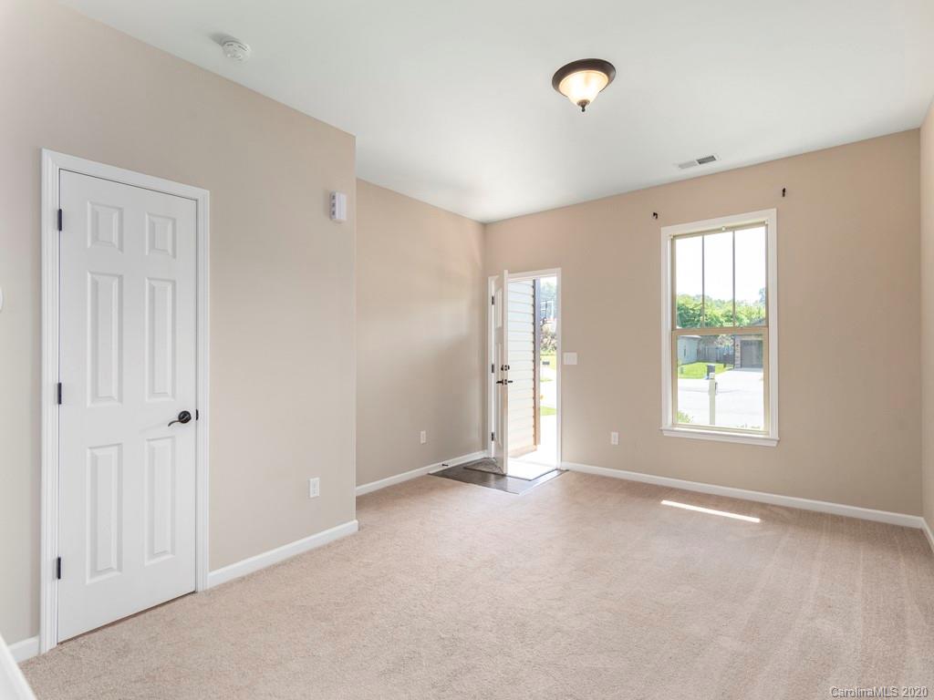 189 North River Road Fletcher, NC 28732 - Photo 3 of 27 a view of an empty room with a window