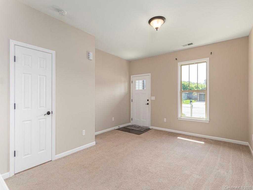 189 North River Road Fletcher, NC 28732 - Photo 4 of 27 a view of an empty room with a window