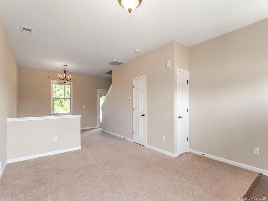 189 North River Road Fletcher, NC 28732 - Photo 6 of 27 an empty room with windows and cabinet