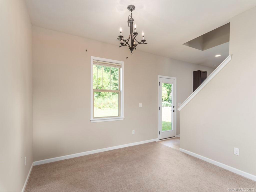 189 North River Road Fletcher, NC 28732 - Photo 7 of 27 a view of an empty room with a window