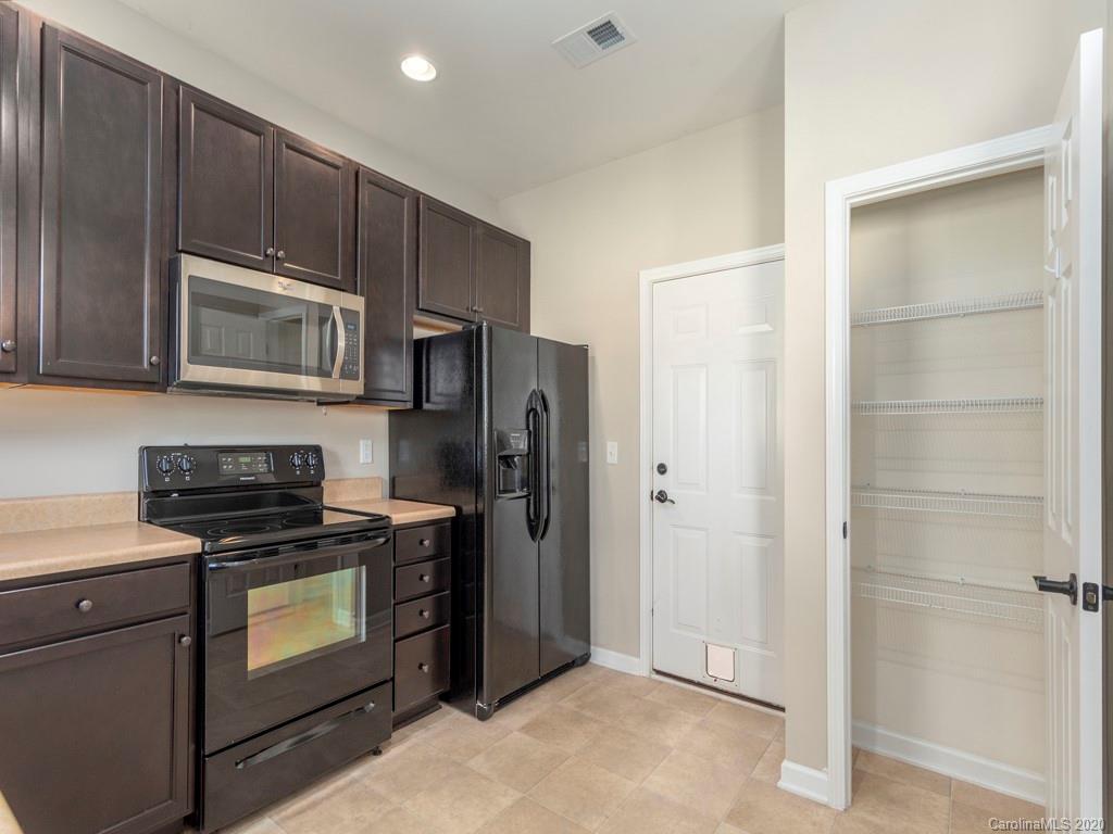 189 North River Road Fletcher, NC 28732 - Photo 10 of 27 a kitchen with a stove microwave and refrigerator