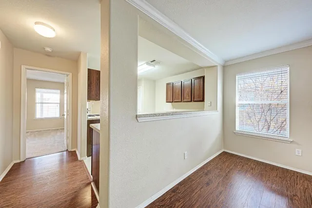 a kitchen with cabinets stove and window