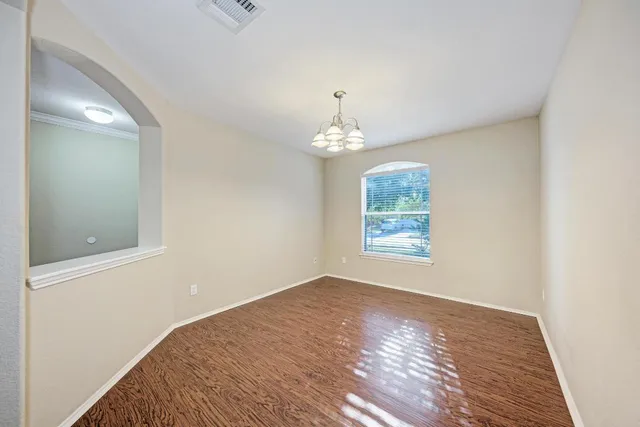 a kitchen with granite countertop stainless steel appliances sink and cabinets