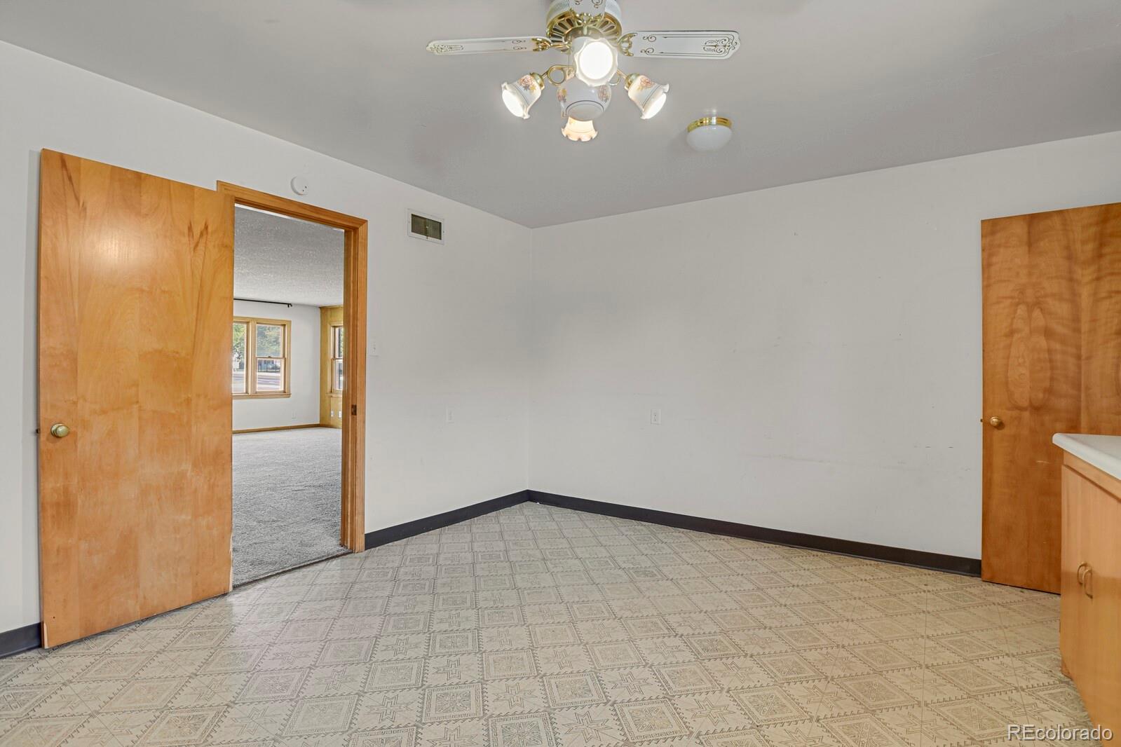 425 West Cheyenne Road Colorado Springs, CO 80906 - Photo 11 of 28 a view of an empty room and chandelier fan