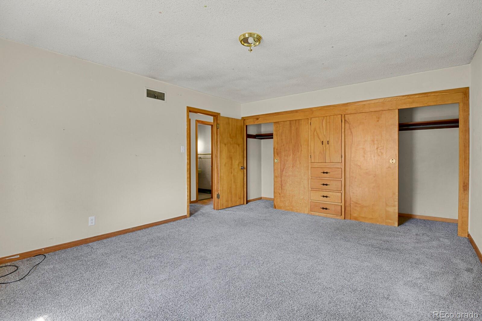 425 West Cheyenne Road Colorado Springs, CO 80906 - Photo 13 of 28 an empty room with closet area