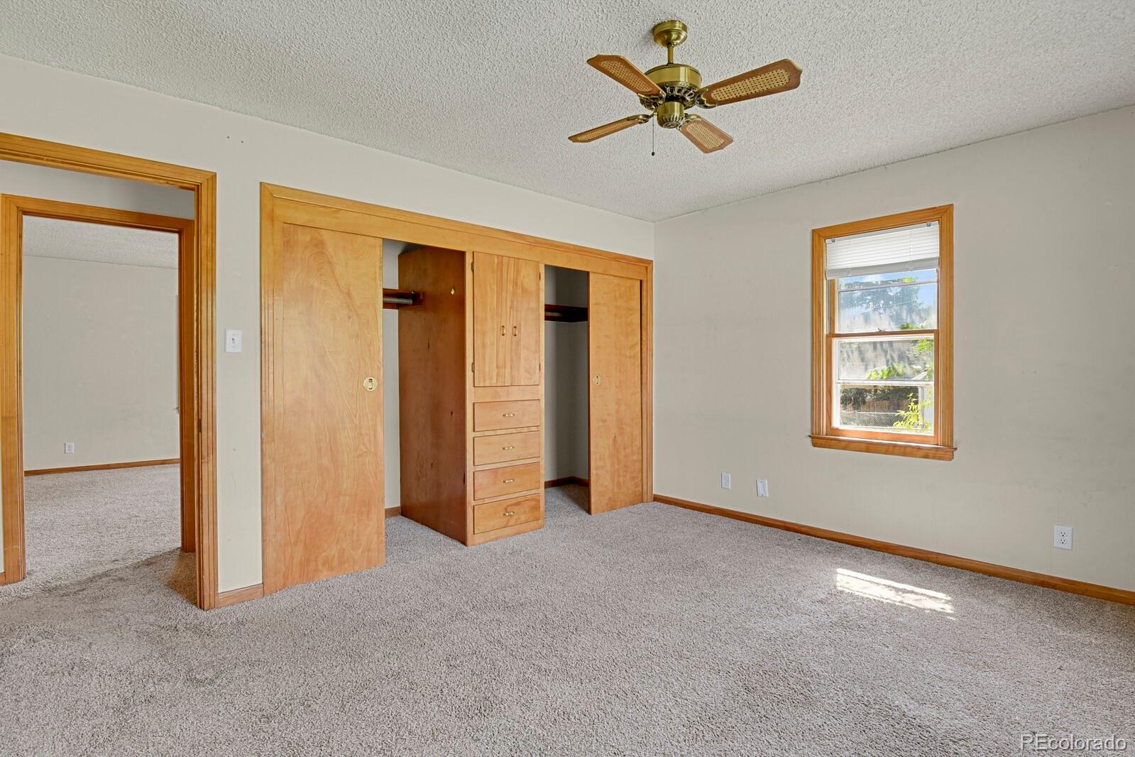 425 West Cheyenne Road Colorado Springs, CO 80906 - Photo 16 of 28 a view of a livingroom with a ceiling fan and window