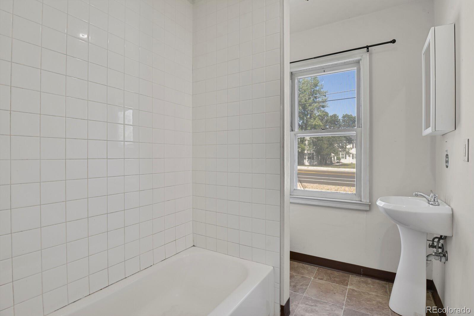 425 West Cheyenne Road Colorado Springs, CO 80906 - Photo 20 of 28 a bathroom with a sink a toilet and shower