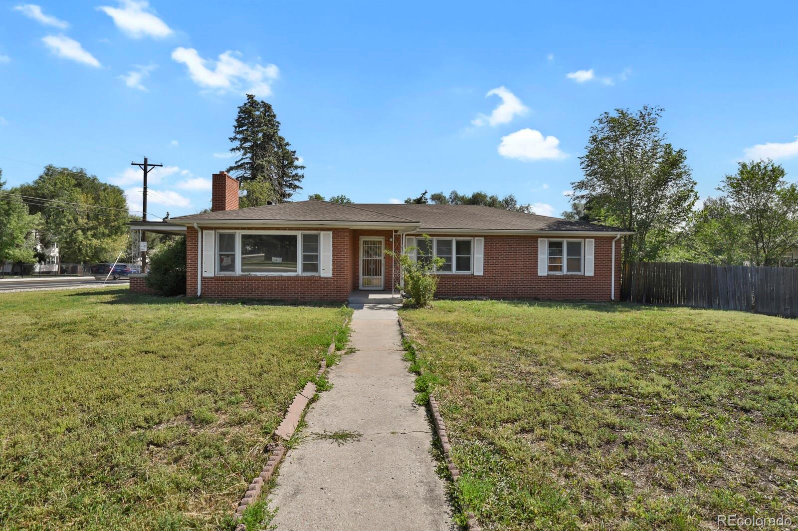 425 West Cheyenne Road Colorado Springs, CO 80906 - Photo 3 of 28 a view of a house with a backyard