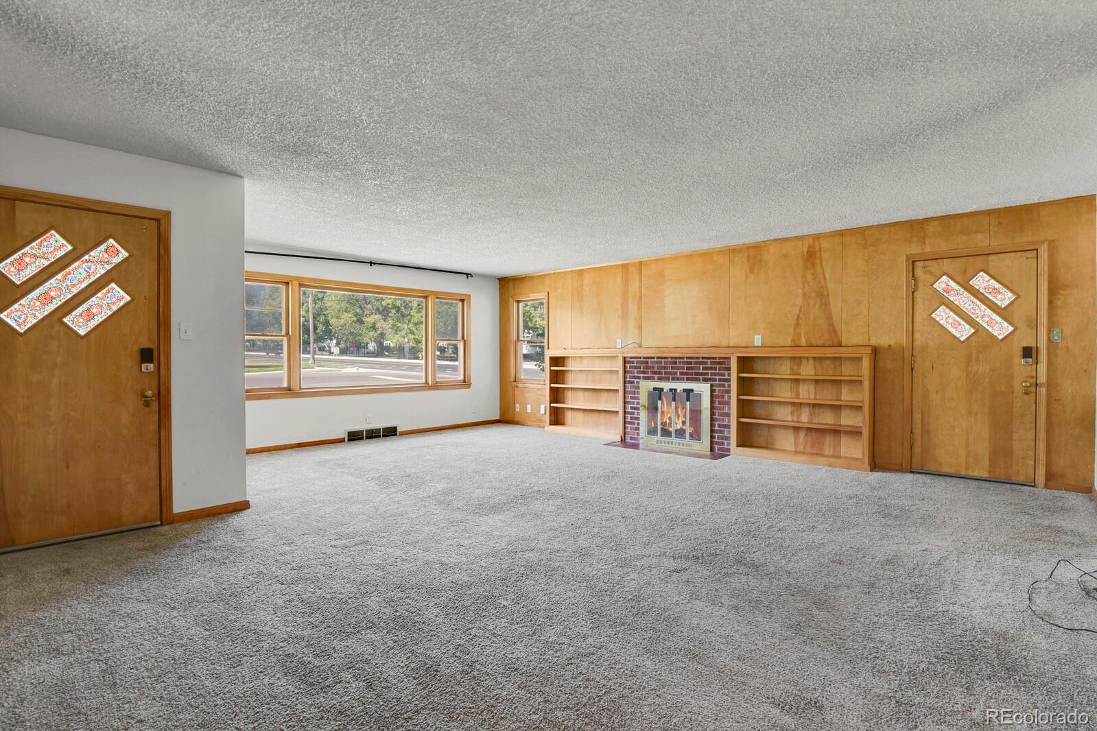 425 West Cheyenne Road Colorado Springs, CO 80906 - Photo 5 of 28 a view of an empty room with a window