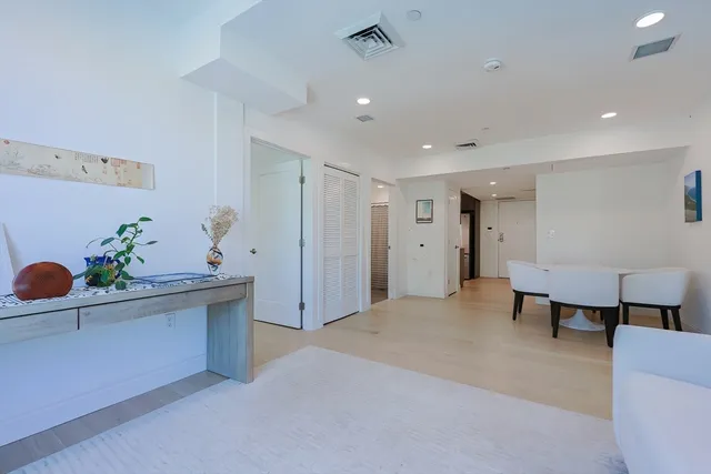 a view of work space with furniture and wooden floor