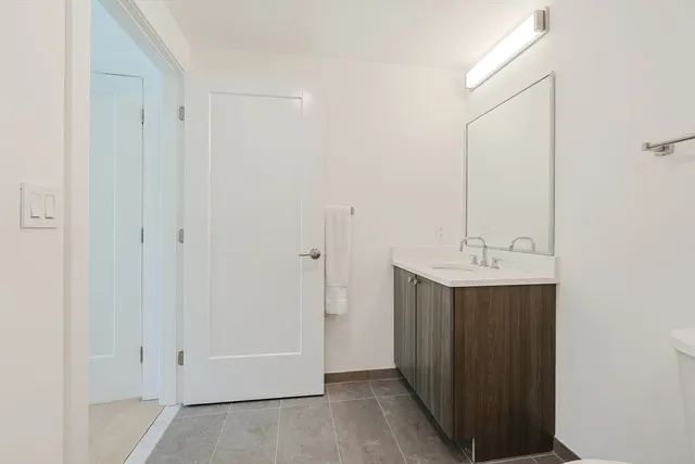a bathroom with a sink and mirror