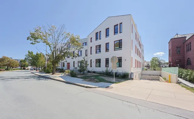 a view of a building with a street