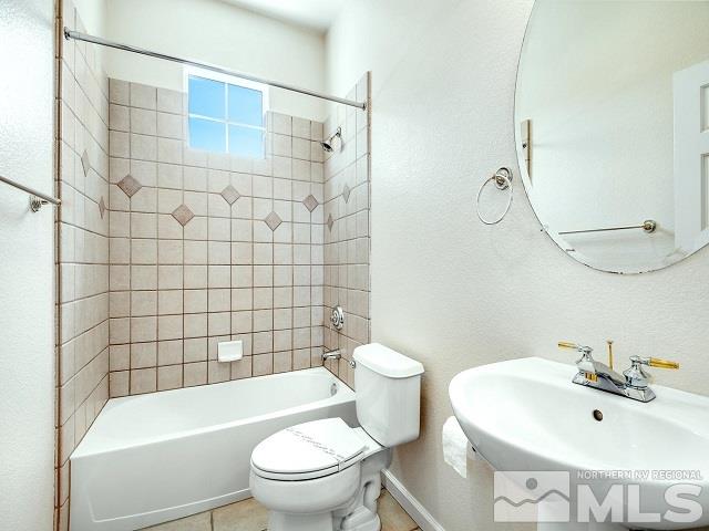 7265 Tempe Court Reno, NV 89511 - Photo 17 of 24 a bathroom with a sink a toilet and shower