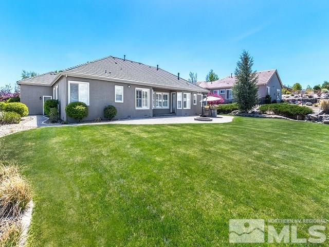 7265 Tempe Court Reno, NV 89511 - Photo 23 of 24 a front view of a house with garden