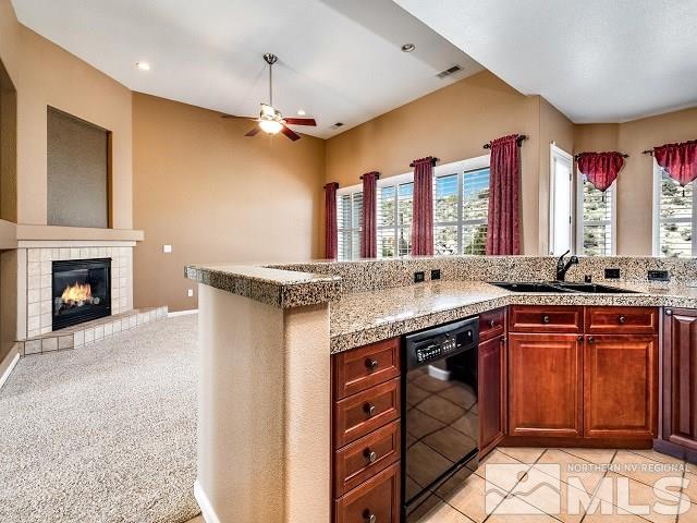 7265 Tempe Court Reno, NV 89511 - Photo 4 of 24 a kitchen with a sink and a stove top oven