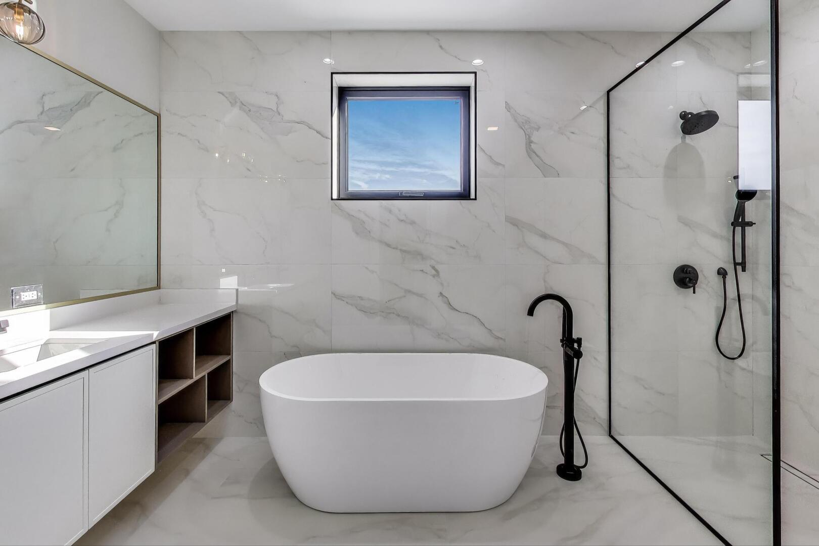 2307 West Foster Avenue, Unit 1 Chicago, IL 60625 - Photo 20 of 34 a bathroom with a tub and shower