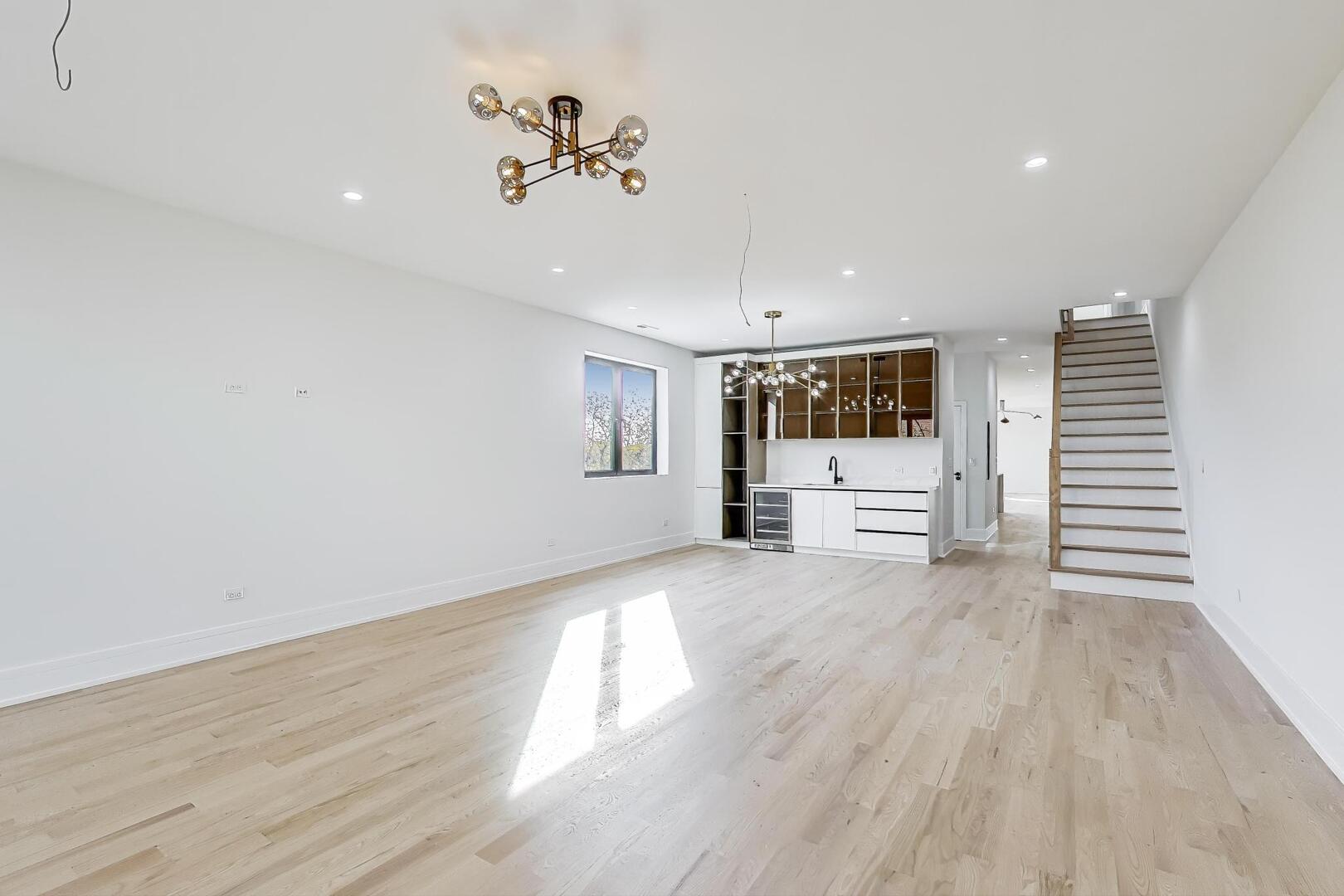 2307 West Foster Avenue, Unit 1 Chicago, IL 60625 - Photo 6 of 34 a view of an empty room with a window