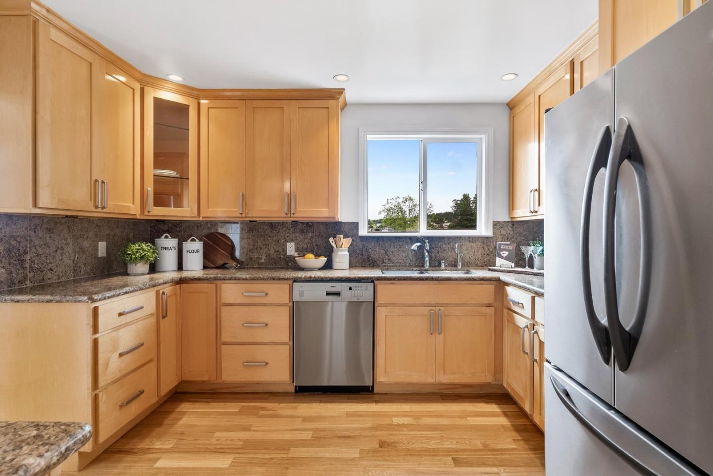 511 Bayview Avenue Millbrae, CA 94030 - Photo 15 of 36 a kitchen with stainless steel appliances granite countertop a refrigerator a stove and a sink