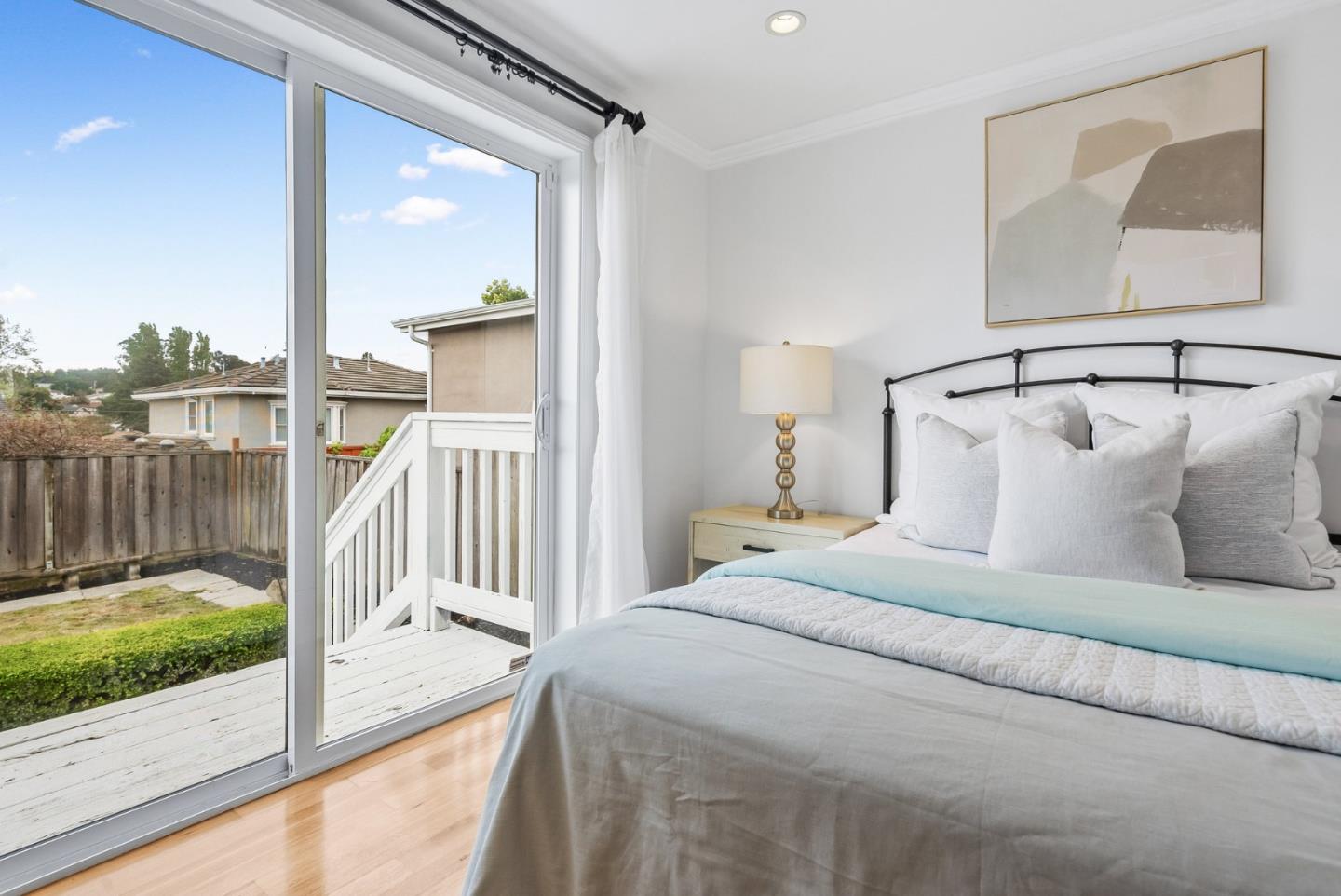 511 Bayview Avenue Millbrae, CA 94030 - Photo 20 of 36 a bedroom with a bed and a view of balcony