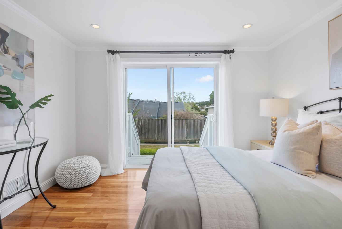 511 Bayview Avenue Millbrae, CA 94030 - Photo 22 of 36 a bedroom with a bed and glass window