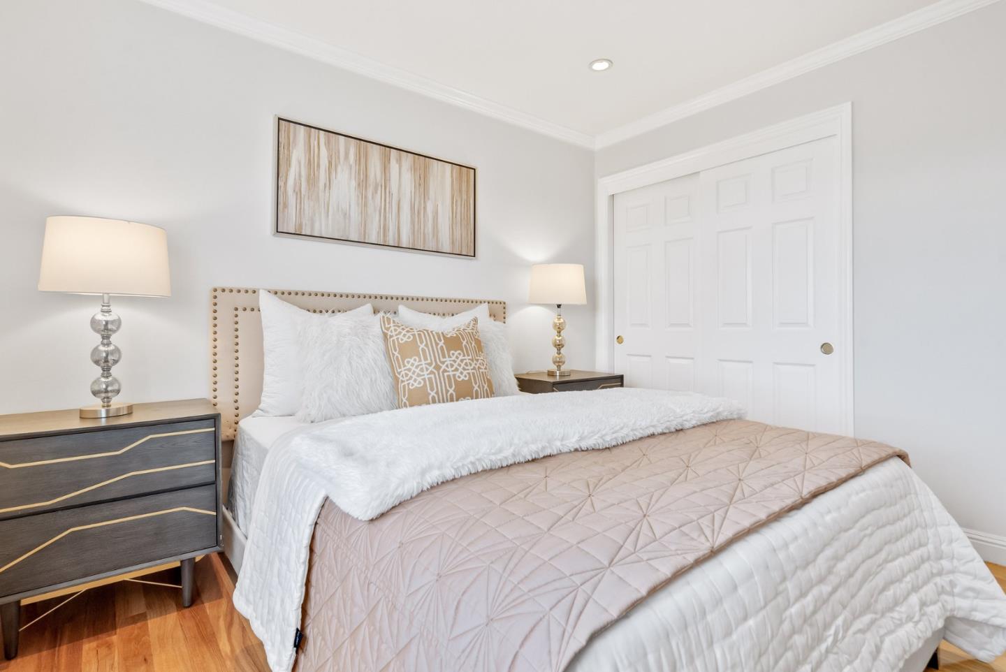 511 Bayview Avenue Millbrae, CA 94030 - Photo 28 of 36 a bedroom with a bed and a lamp