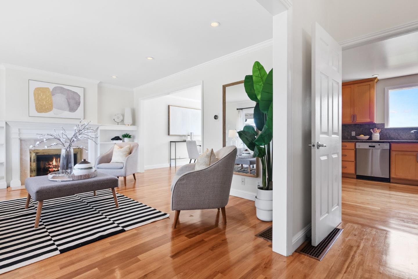 511 Bayview Avenue Millbrae, CA 94030 - Photo 4 of 36 a living room with furniture and a fireplace