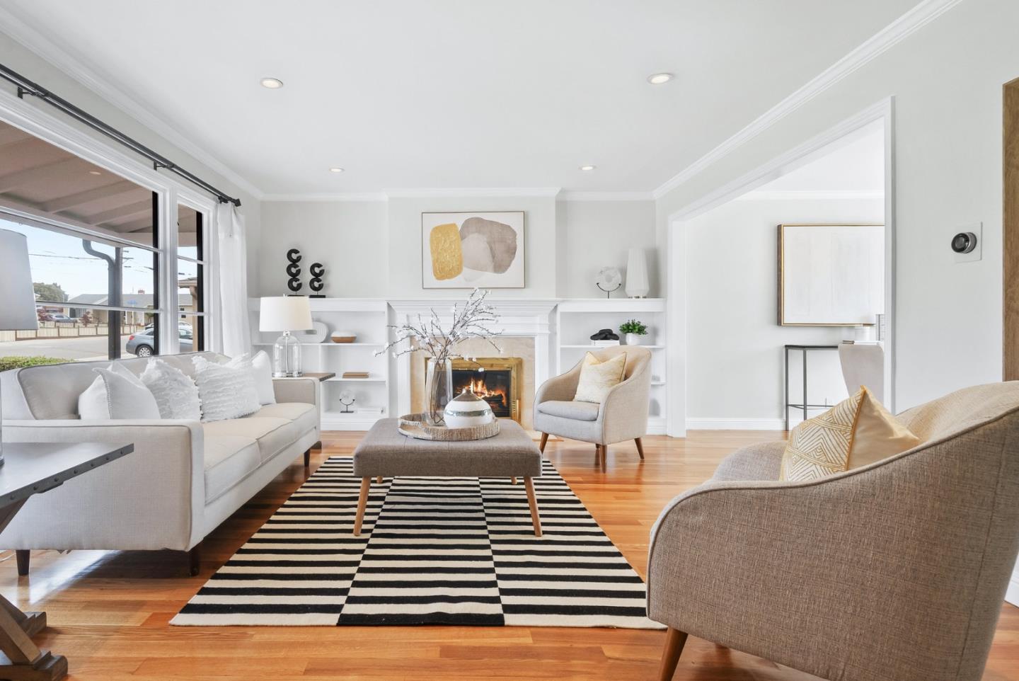 511 Bayview Avenue Millbrae, CA 94030 - Photo 5 of 36 a living room with furniture a fireplace and a table