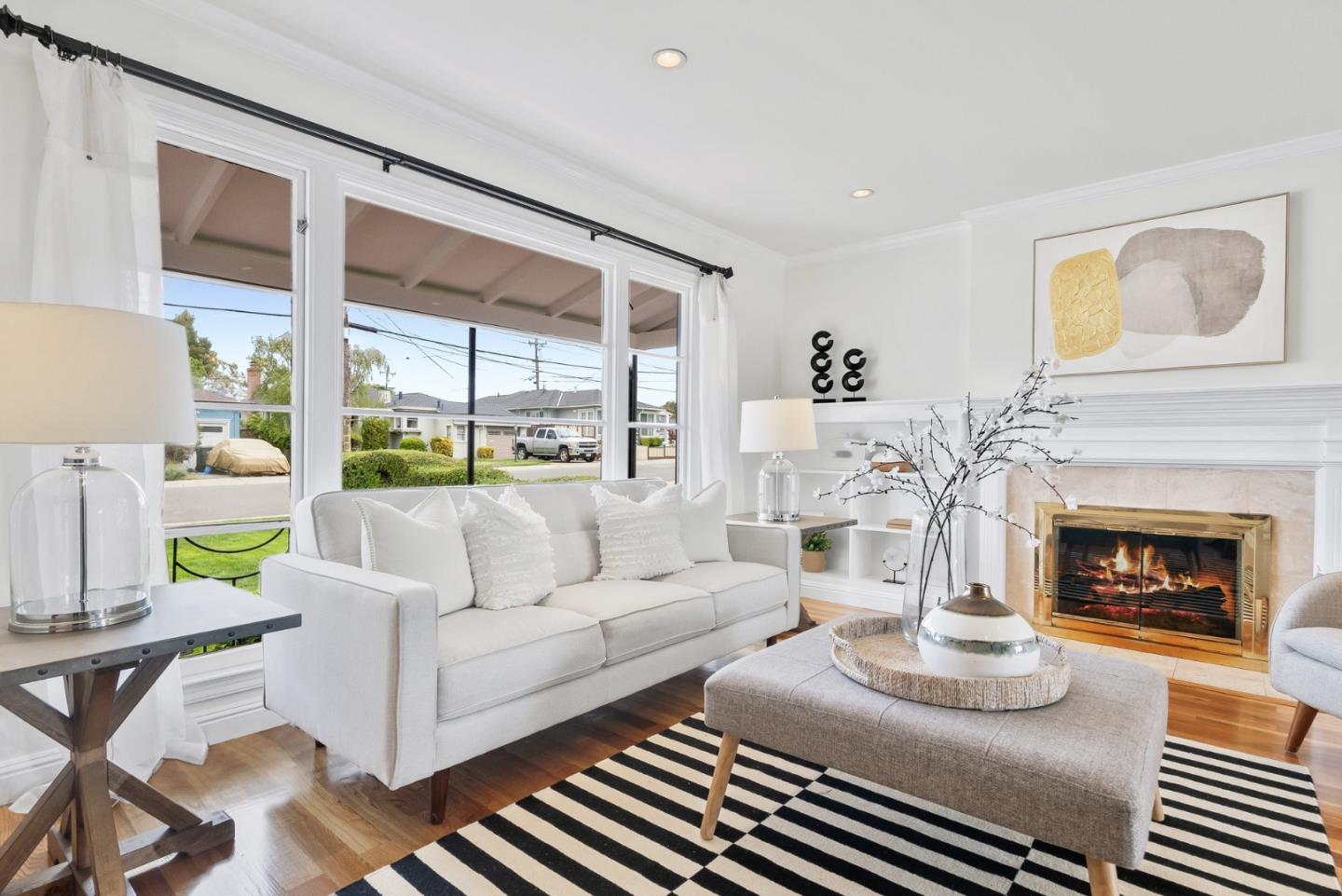 511 Bayview Avenue Millbrae, CA 94030 - Photo 6 of 36 a living room with furniture a fireplace and a large window