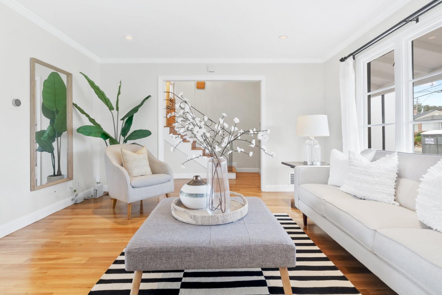 511 Bayview Avenue Millbrae, CA 94030 - Photo 8 of 36 a living room with furniture and a table