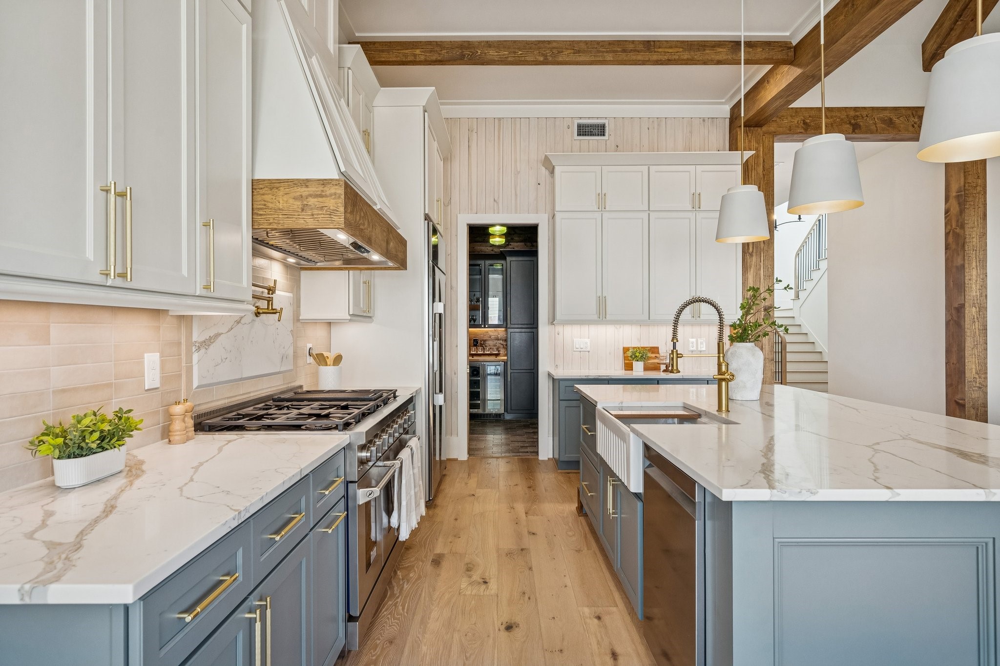 511 Graceland Street Houston, TX 77009 - Photo 11 of 45 A 48 in gas range with a commercial grade vent hood, and 42in built in fridge set the tone for the appliances. Quartz counters, pot filler, shoji washed wood accents and pendant lighting bring the bling.