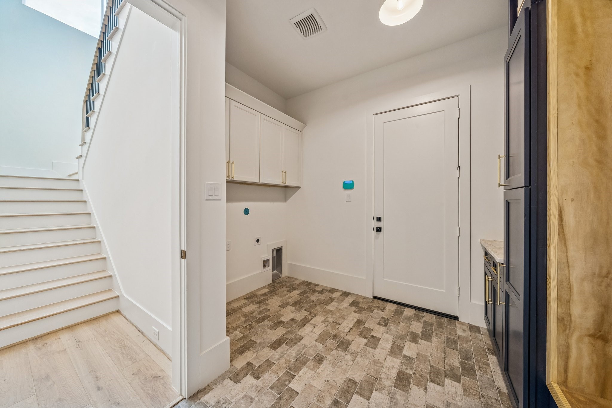 511 Graceland Street Houston, TX 77009 - Photo 18 of 45 The washer and dryer has a home in the mudroom. Easy to access from the upstairs bedrooms as well as the primary.