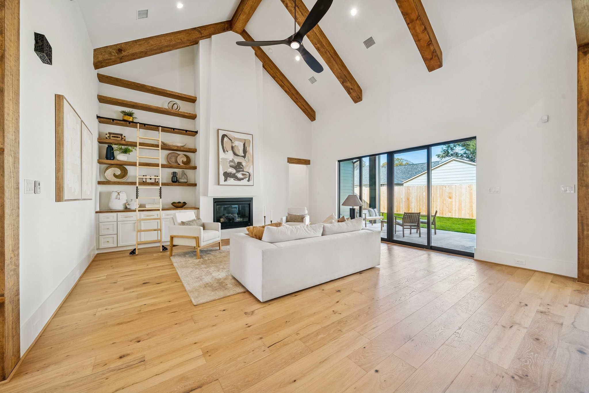 511 Graceland Street Houston, TX 77009 - Photo 6 of 45 This room might render you speechless. From the 20 ft vaulted ceiling to the floating shelves and rolling library ladder, no detail has been left out. The doors slide apart for a seamless indoor/outdoor lifestyle.