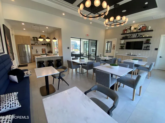 a view of a patio with dining table and chairs with a patio