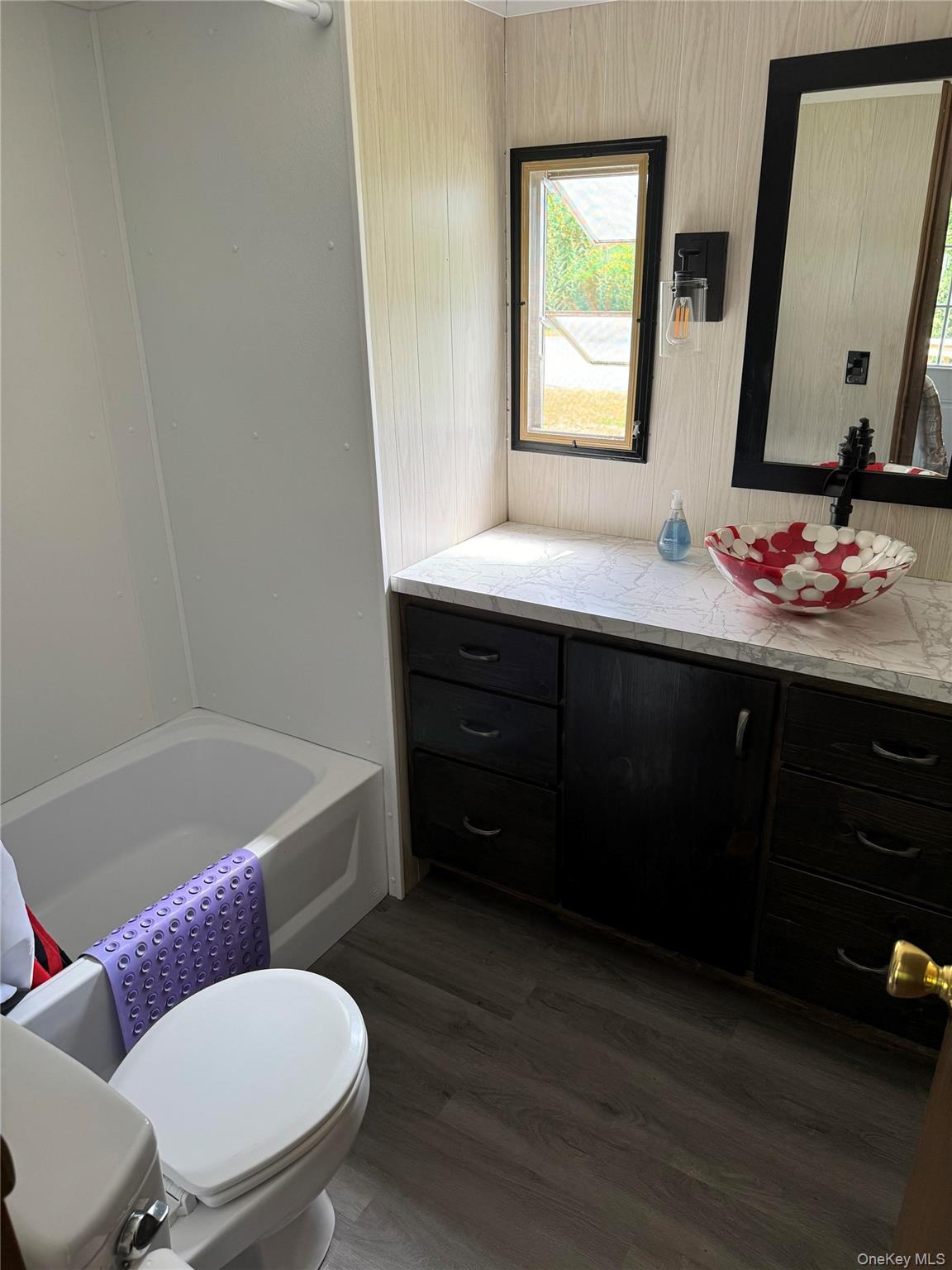 204 Mongaup Road Hurleyville, NY 12747 - Photo 6 of 9 a bathroom with a sink vanity mirror bathtub and toilet