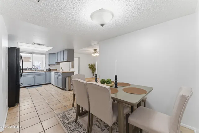 a view of a dining room with furniture and a chandelier
