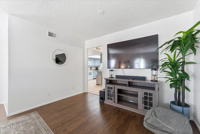 a view of a livingroom with furniture and a potted plant