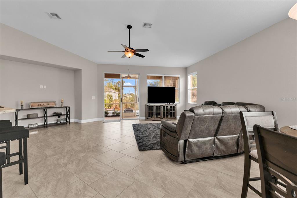 25409 Durango Court Punta Gorda, FL 33955 - Photo 11 of 46 a living room with furniture and a flat screen tv