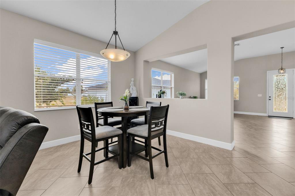 25409 Durango Court Punta Gorda, FL 33955 - Photo 12 of 46 a view of a dining room with furniture window and wooden floor
