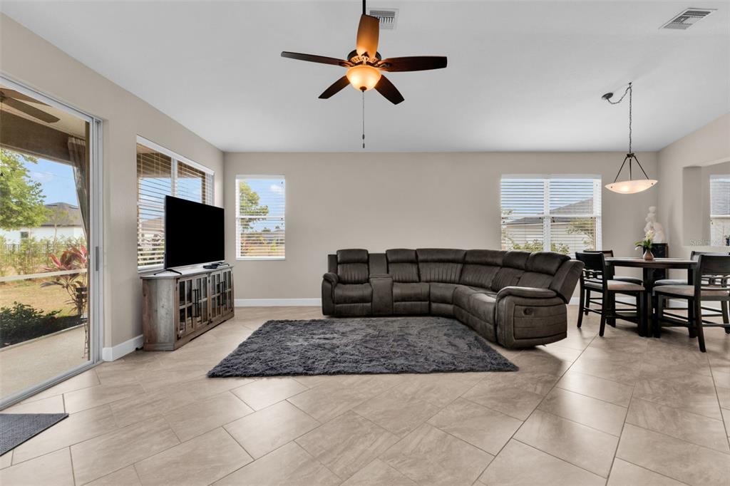 25409 Durango Court Punta Gorda, FL 33955 - Photo 13 of 46 a living room with furniture and a flat screen tv