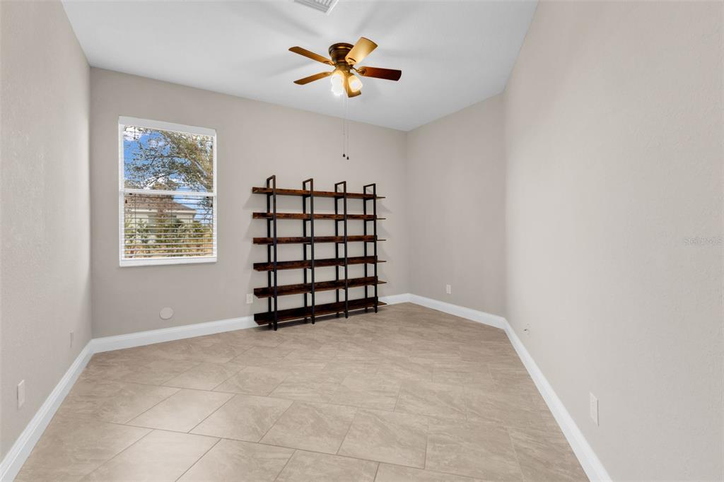 25409 Durango Court Punta Gorda, FL 33955 - Photo 21 of 46 an empty room with windows and ceiling fan