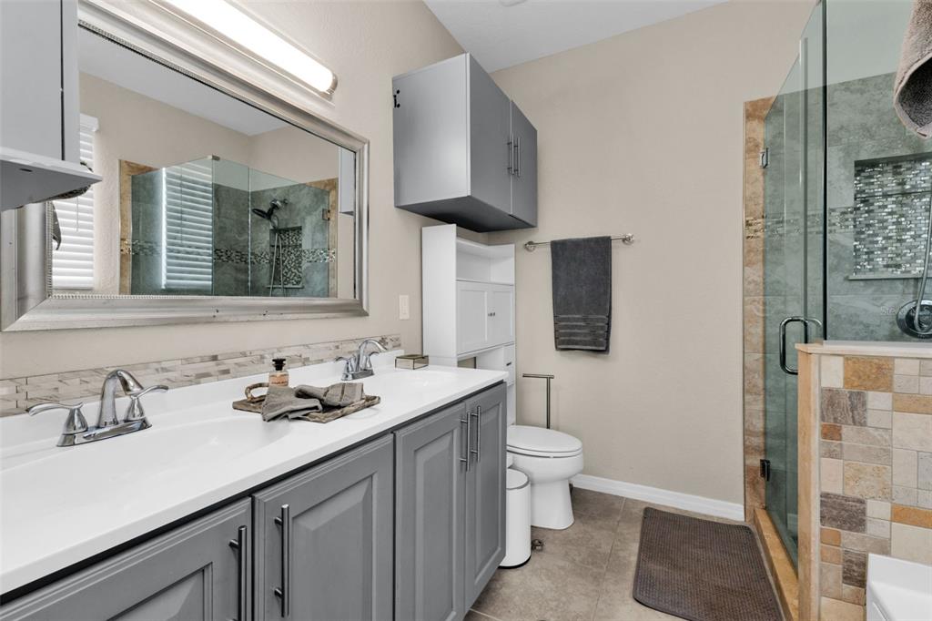 25409 Durango Court Punta Gorda, FL 33955 - Photo 27 of 46 a bathroom with a sink and a mirror