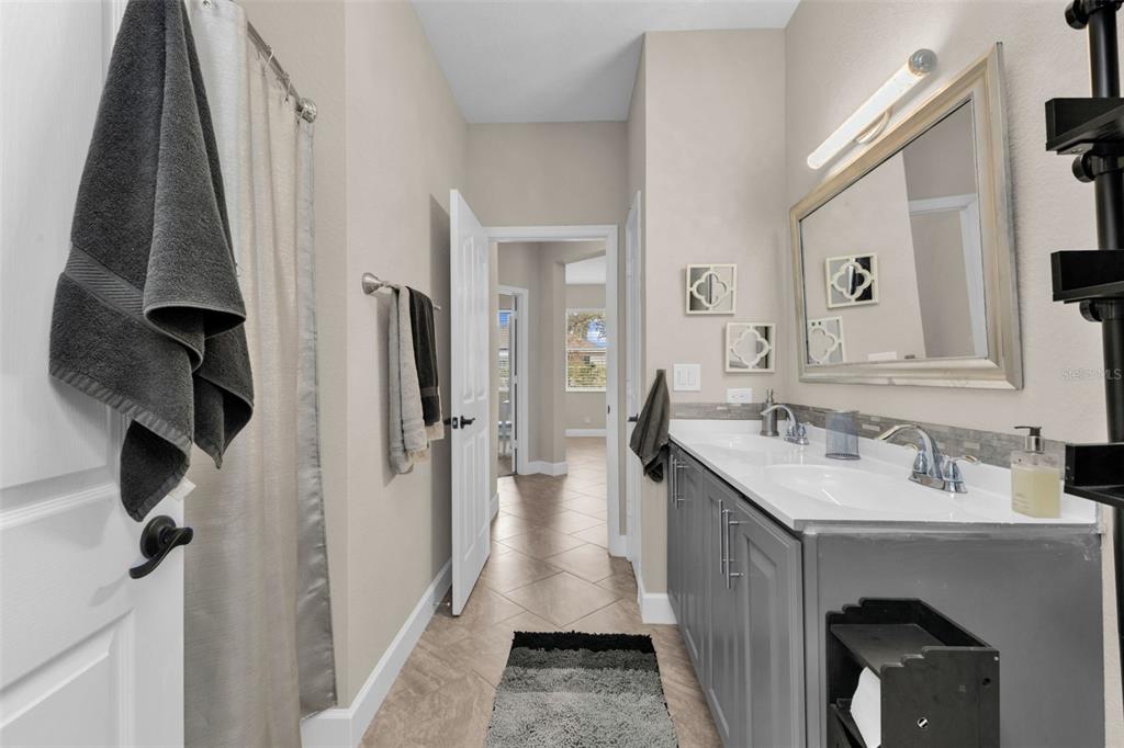 25409 Durango Court Punta Gorda, FL 33955 - Photo 33 of 46 a bathroom with a sink a toilet and a mirror