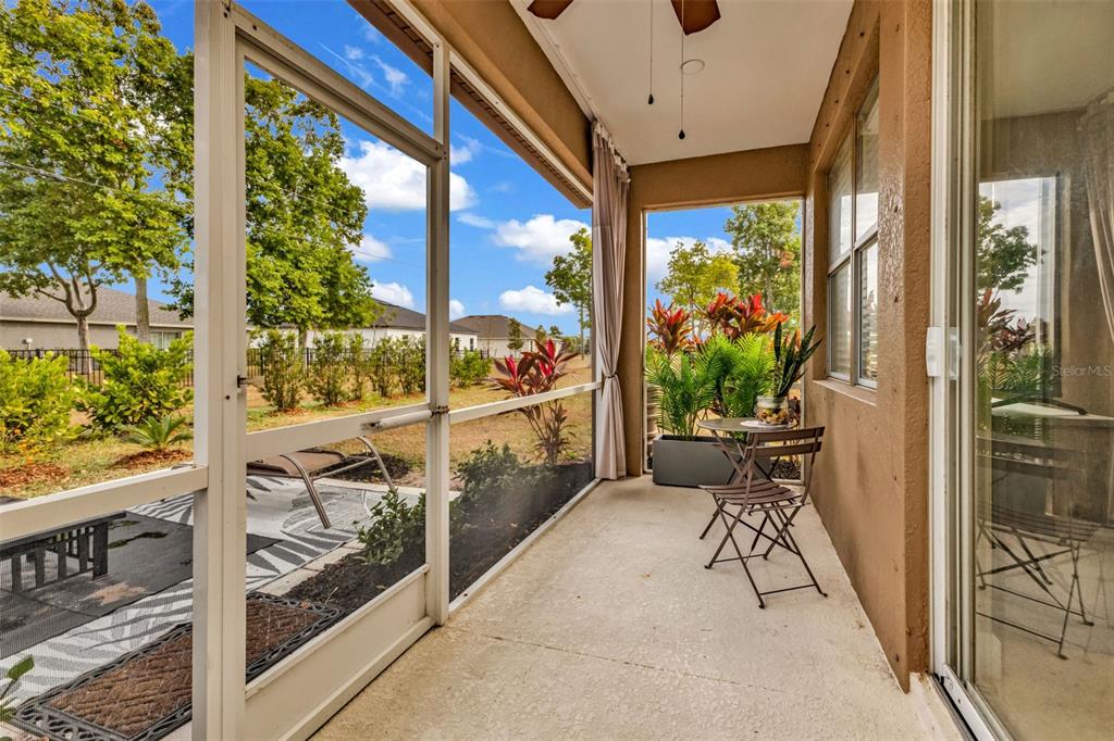25409 Durango Court Punta Gorda, FL 33955 - Photo 39 of 46 a balcony view with a potted plant and outdoor seating