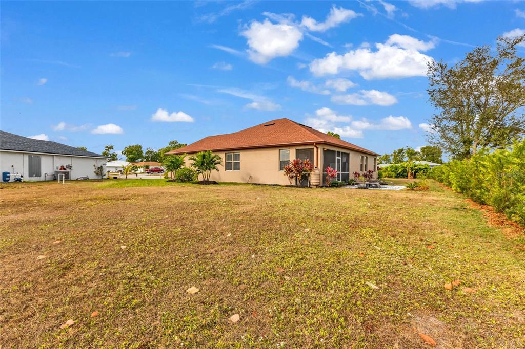 25409 Durango Court Punta Gorda, FL 33955 - Photo 42 of 46 a front view of house with yard and green space