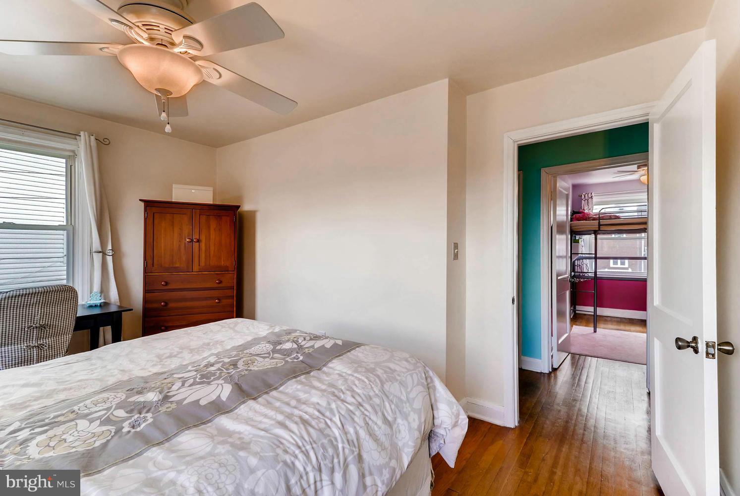 1753 Amuskai Road Baltimore, MD 21234 - Photo 14 of 28 a bedroom with a bed and a chandelier