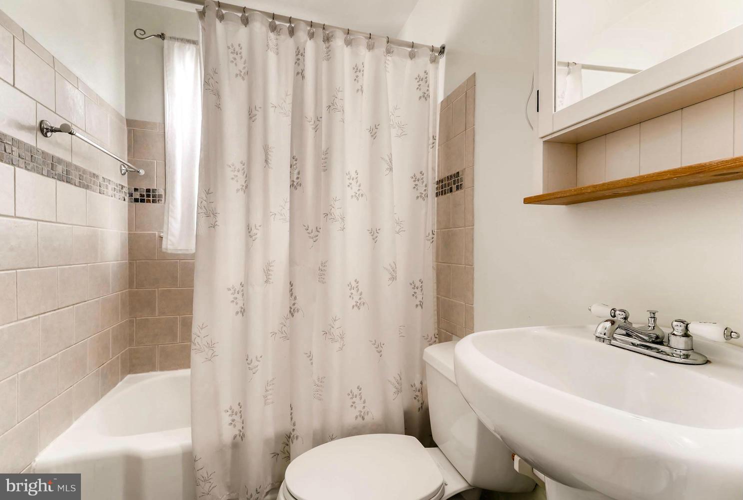 1753 Amuskai Road Baltimore, MD 21234 - Photo 17 of 28 a bathroom with a sink toilet and shower